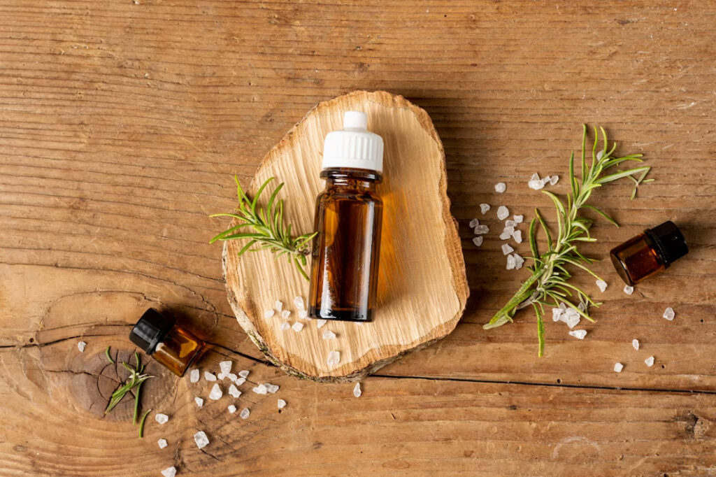 top-view-bottle-oil-piece-wood_23-2148290941